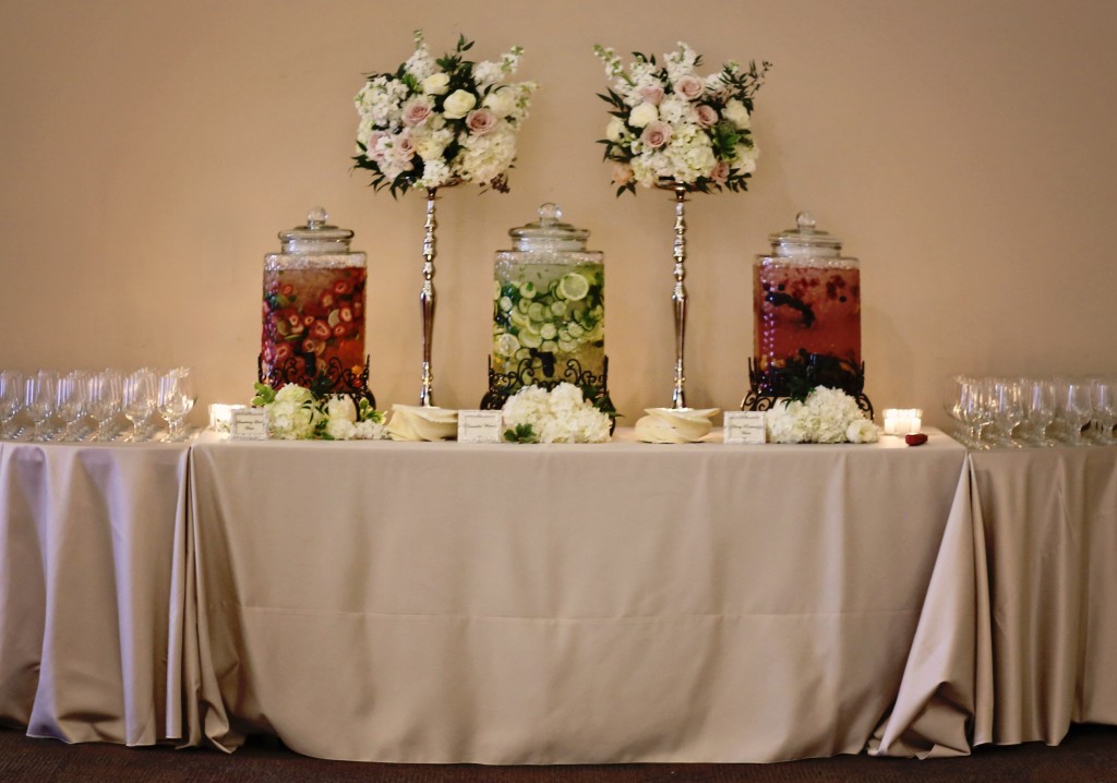 beverage station | ivory and blush centerpiece on silver stands | wedding florist southern productions weddings & events meridian ms